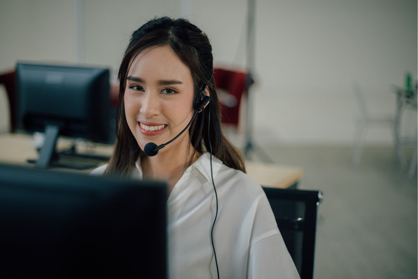 Woman wearing phone headset smiling